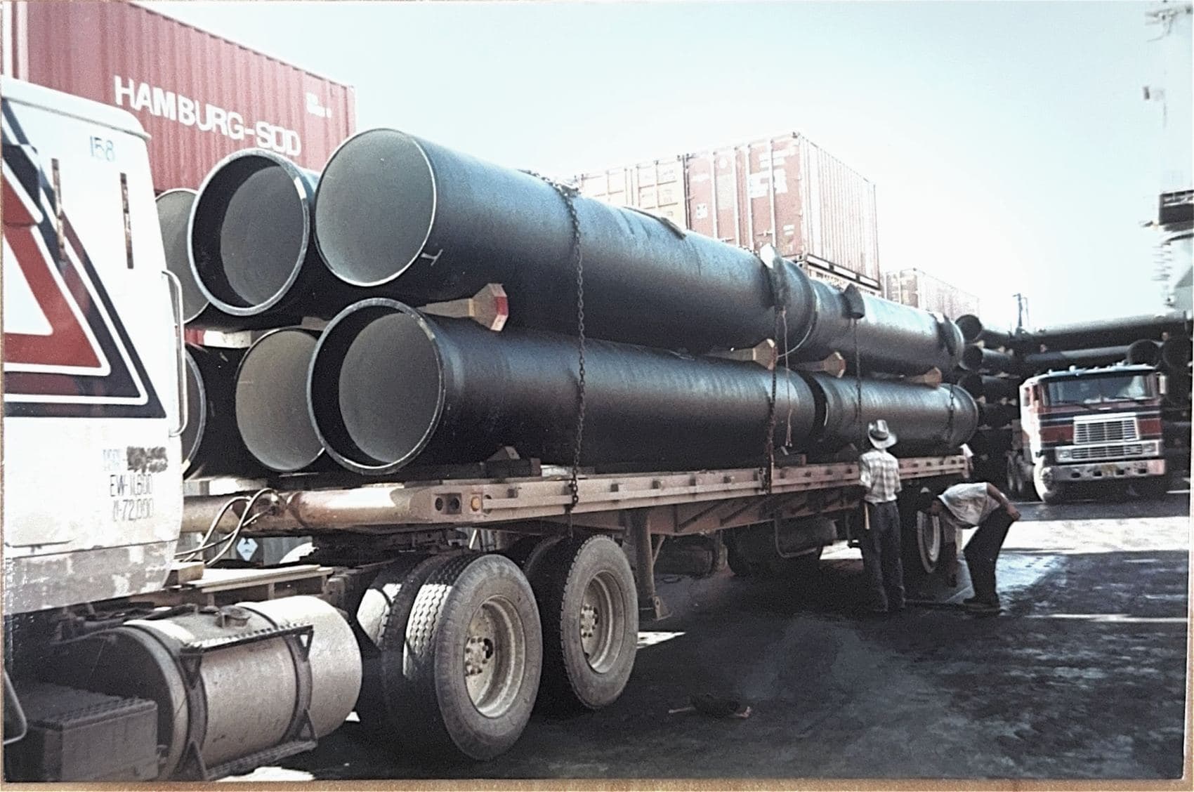 Pipe loaded on flatbed at port